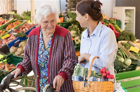 Older lady is assisted with shopping