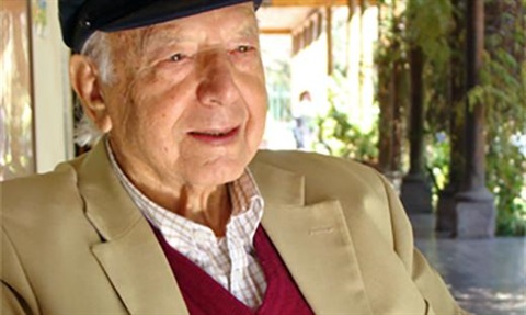 a man, Morrie, sits out the front of his house