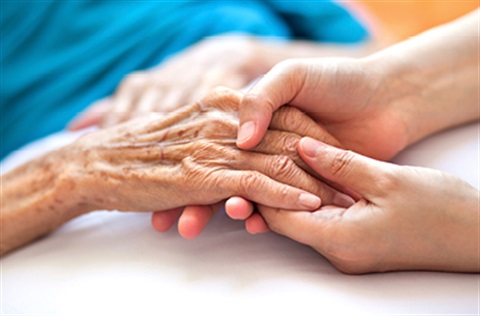 Two people holding hands