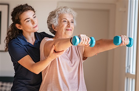 personal trainer with patient 