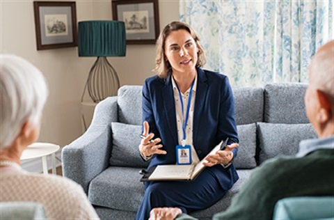 woman talking to older couple