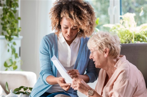 two women looking at document