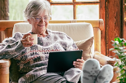 woman looking at tablet
