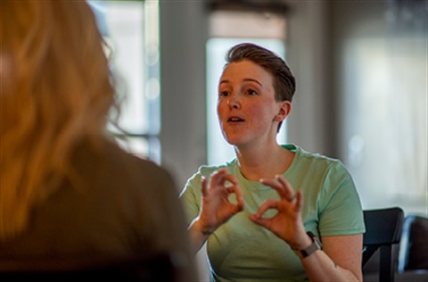 two women using sign language